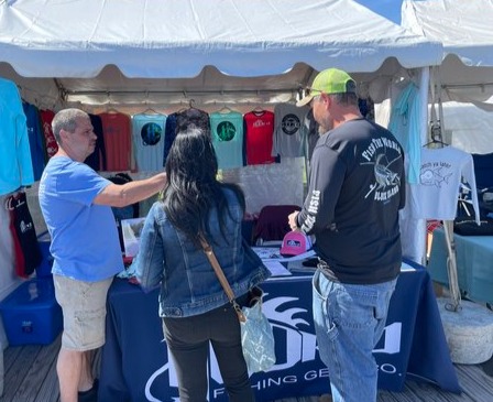 Connecticut Spring boat show visitors at a booth