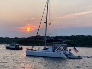 Catamaran with sunset in the background. A good boat to sail in North America