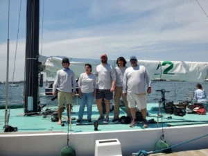 the 5 Team member of the America's cup boat. Sailing for a good cause. Green deck