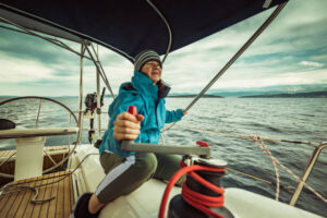 woman sailor at a winch on a sailboat
