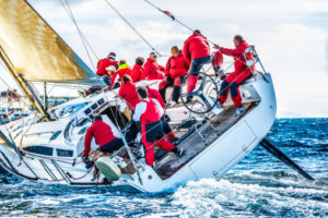 Sailing crew on sailboat during regatta