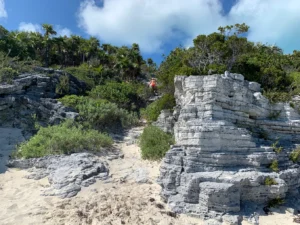 Climbing rocks, white sands and a few rocks. This is part of the catamaran sailing adventure